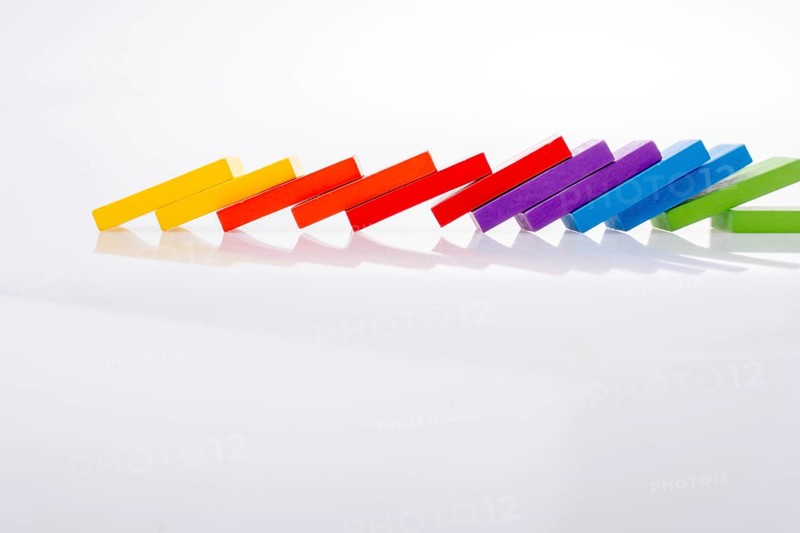 Colorful Domino Blocks in a line on a white background