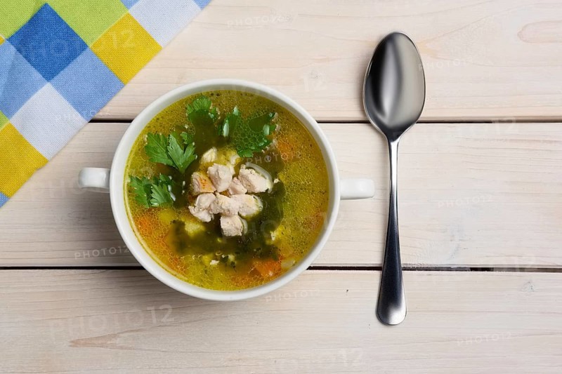 Top view of table with served fish soup