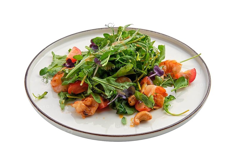 Salad with shrimps and fresh vegetables isolated on white background