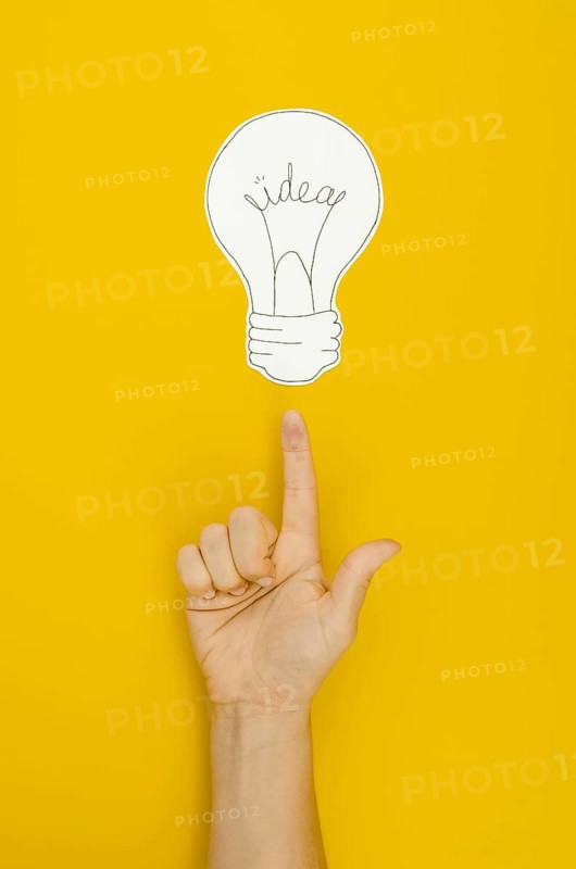 Hand pointing lighten bulb