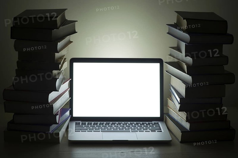 Laptop dark stacked books. Resolution and high quality beautiful photo