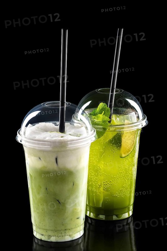Cold refreshing cocktails in take away glass isolated on black background