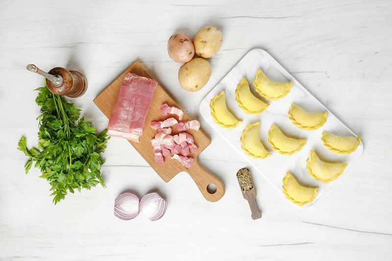 Top view of frozen dumplings with bacon and potato