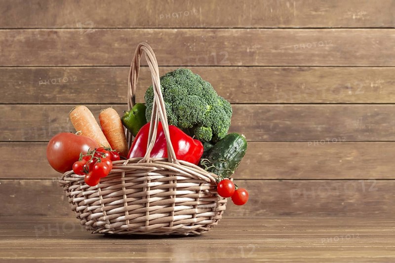 Wooden background with basket full vegetables. Resolution and high quality beautiful photo