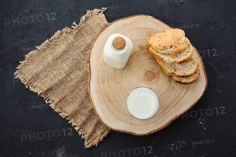 Top view of bottle and a glass of fresh milk