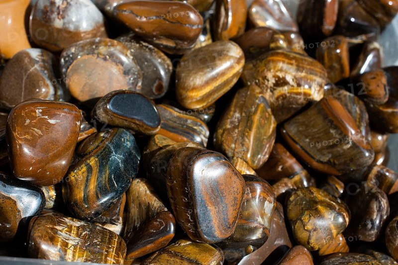 Tiger's eye and hawk's eye gemstone as natural mineral rock specimen