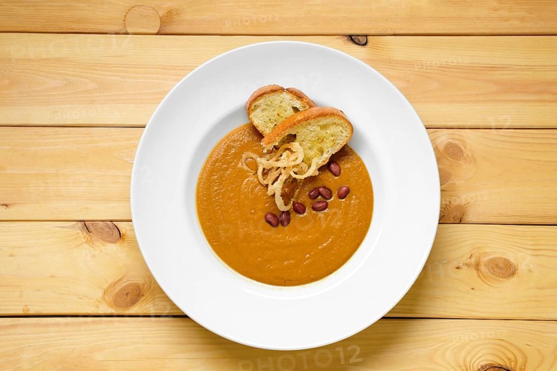 Top view of beans cream soup with croutons