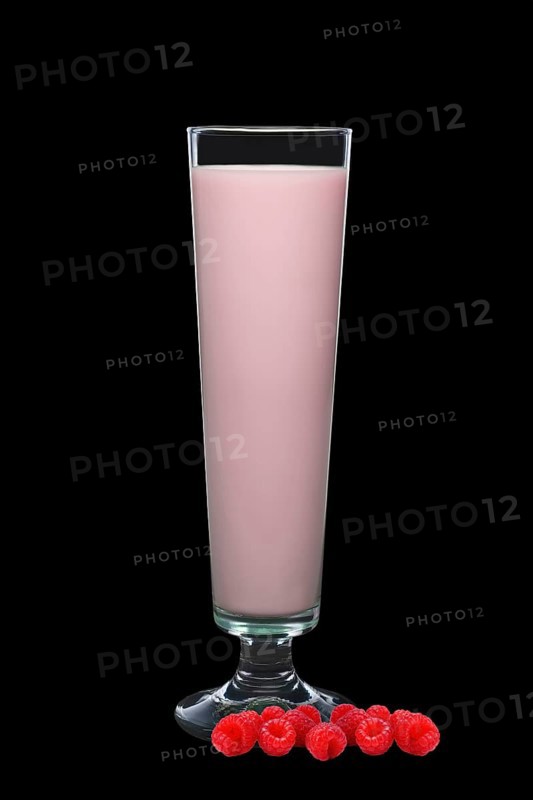 Tall glass of raspberry milk isolated on black background