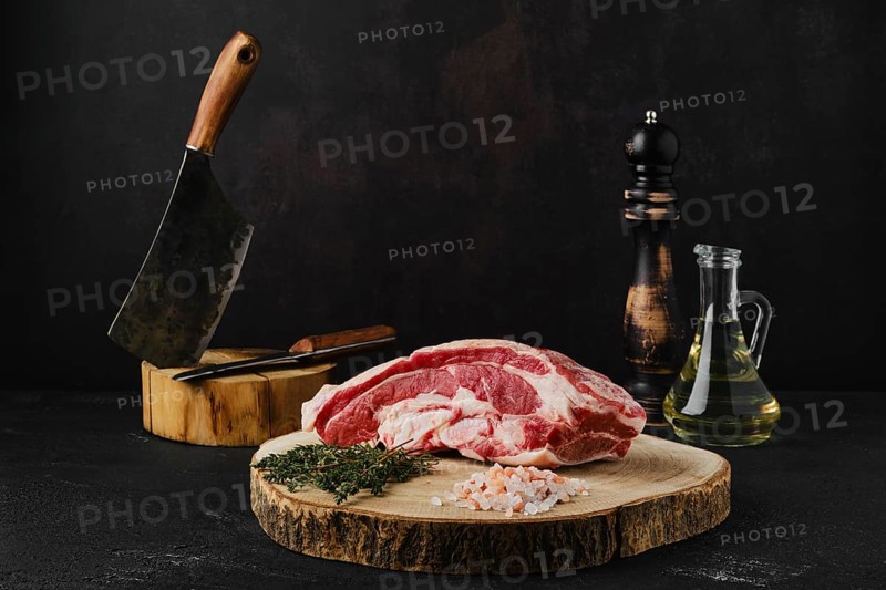 Raw beef brisket on wooden cutting board