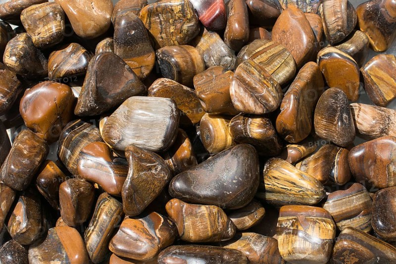 Tiger's eye and hawk's eye gemstone as natural mineral rock specimen