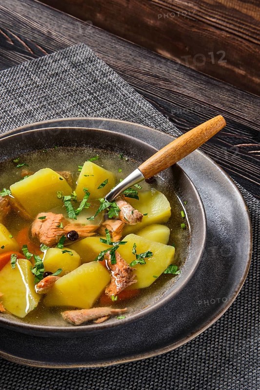 Red salmon fish soup with potato and carrot