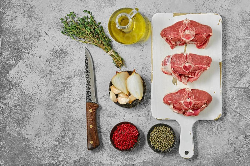 Raw fresh lamb saddle cut on sections