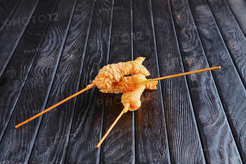 Appetizer for reception. Deep-fried shrimp on skewer