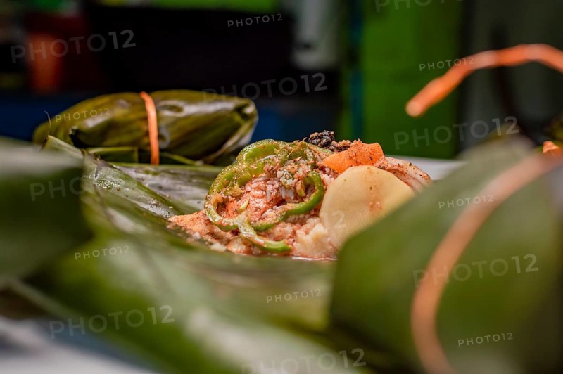 Closeup of raw ingredients for the elaboration of a Nicaraguan nacatamal. Nacatamal ingredients on banana leaves