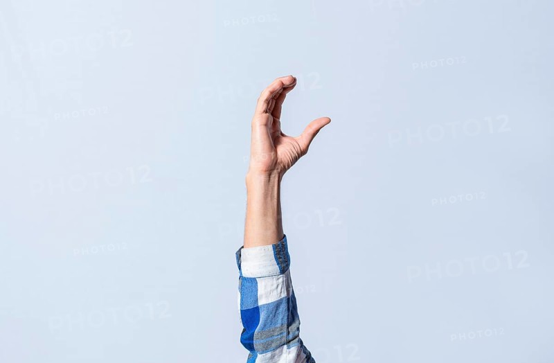 Hand gesturing the letter C in sign language on isolated background. Man hand gesturing letter C of alphabet isolated. Letters of the alphabet in sign language