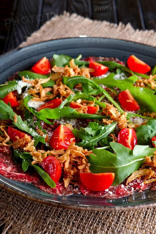 Beef carpaccio with tomato cherry
