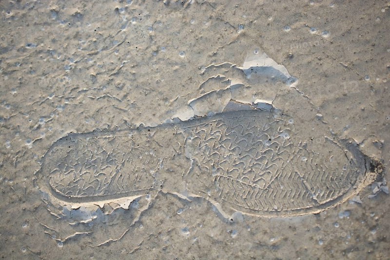 Footstep pattern seen on a concrete background