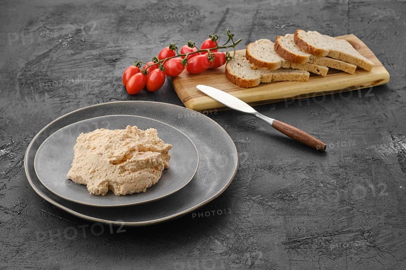 Homemade soft cheese ricotta with paprika and dill on the plate