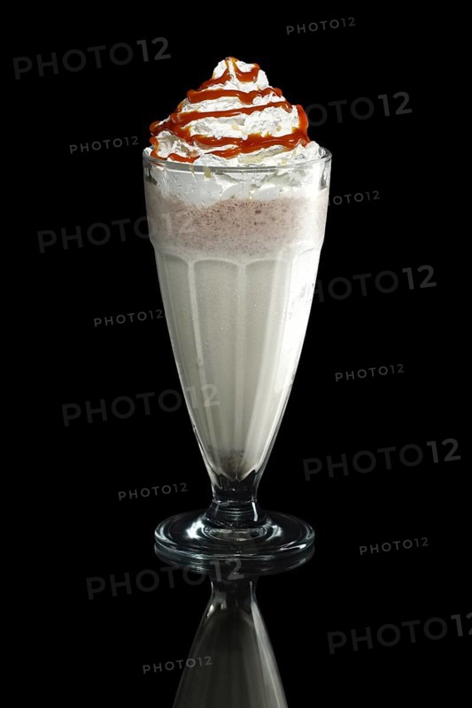 Milkshake caramel summer cocktail isolated on black