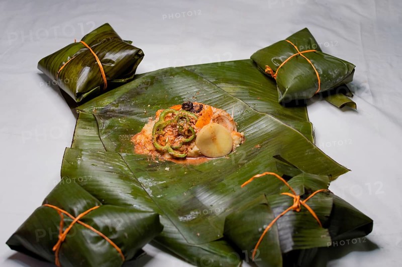 Top View of raw ingredients of the Nicaraguan nacatamal on banana leaves. Raw ingredients for the preparation of the traditional Nacatamal