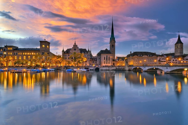 Local view of the illuminated old town of Zurich after sunset