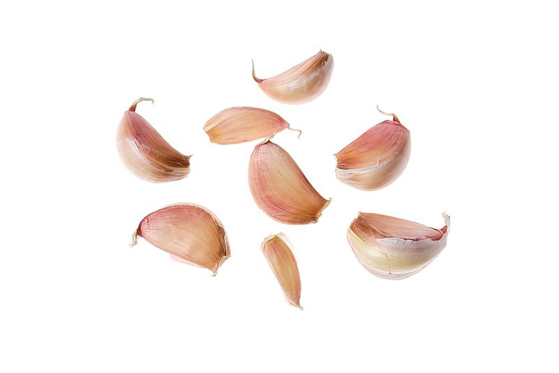Cloves of garlic isolated on white