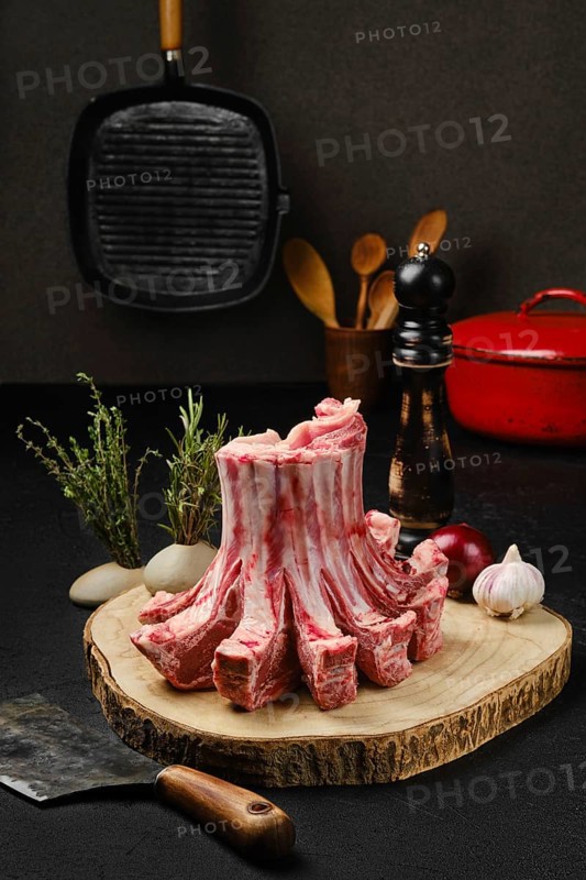 Raw fresh lamb crown roast on the kitchen table