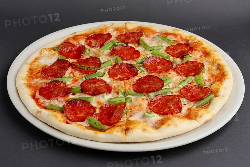 Pizza pepperoni on black table