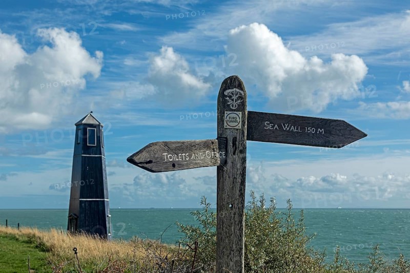 Tower and signpost