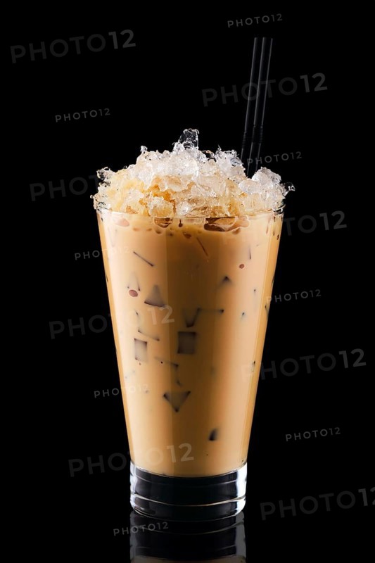 Milkshake with coffee and crushed ice isolated on black background
