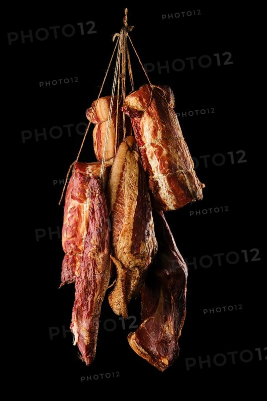 Assortment of air dried and smoked lamb and beef meat on hanger