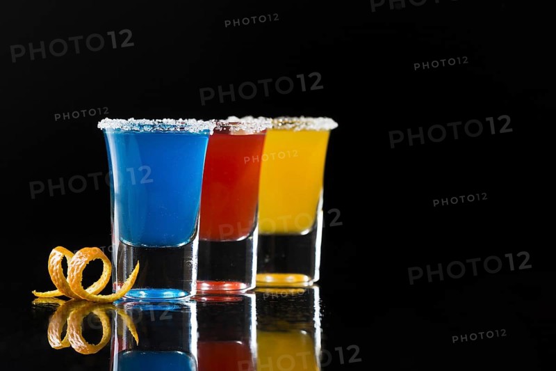 Three shot glasses with cocktails coy space. Resolution and high quality beautiful photo