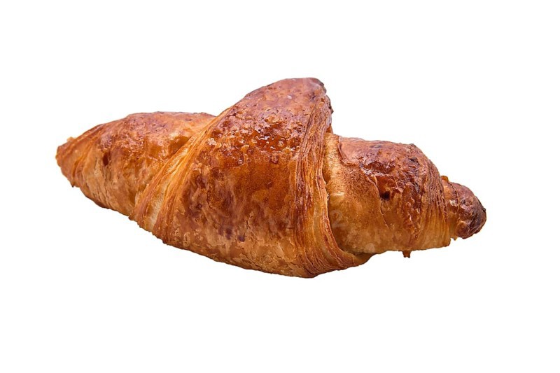 Fresh and tasty croissant over white background