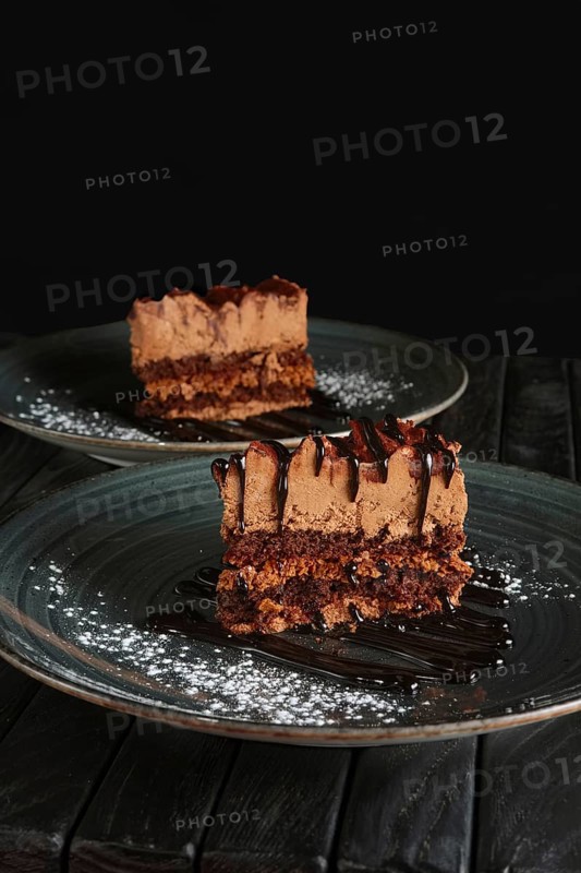 Two pieces of puffy chocolate cake with souffle