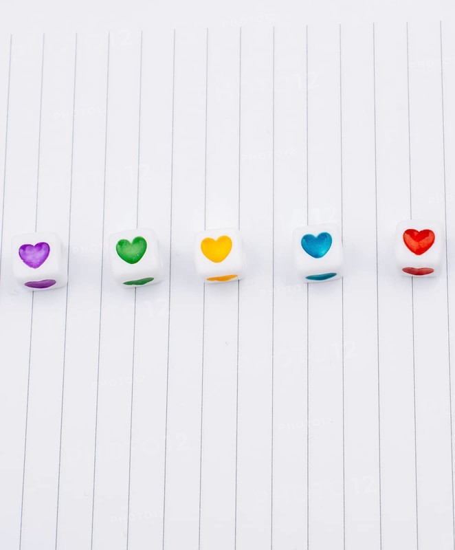 Love cubes and paper arrow on a notebook