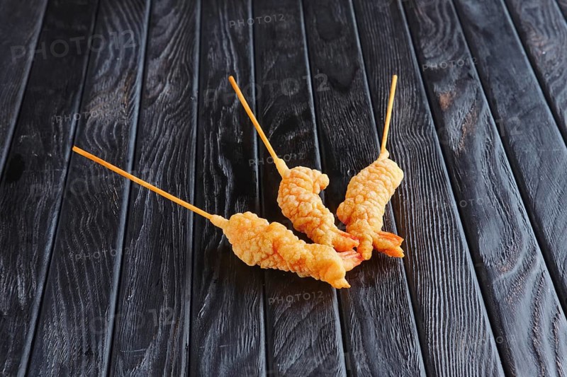 Appetizer for reception. Deep-fried shrimp on skewer