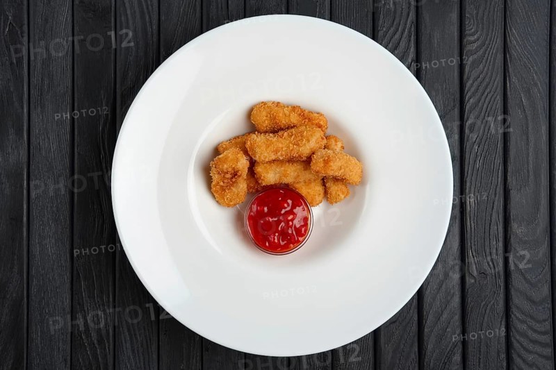 Deep fried chicken nuggets on a plate