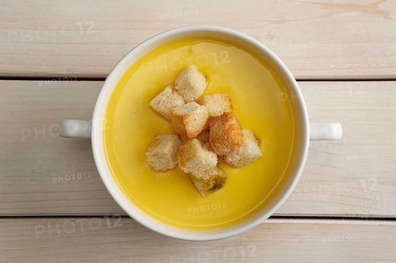 Chicken soup puree with white bread chips
