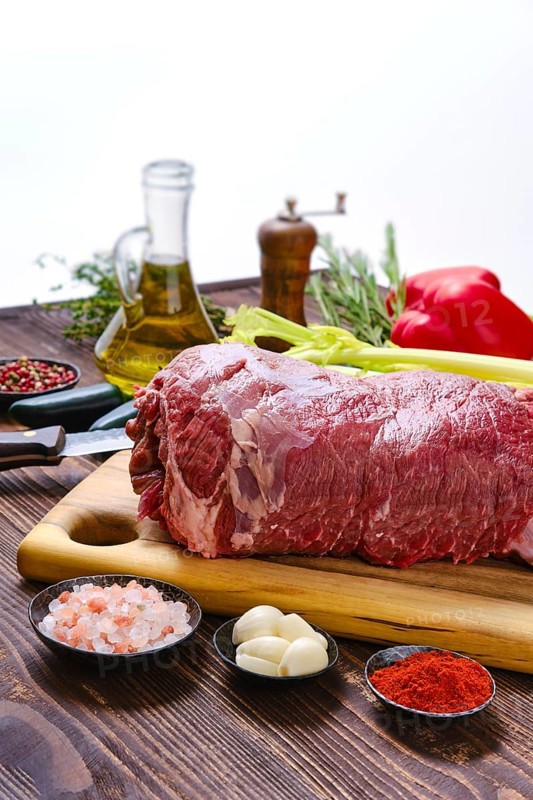 Beef fillet with vegetables on kitchen table