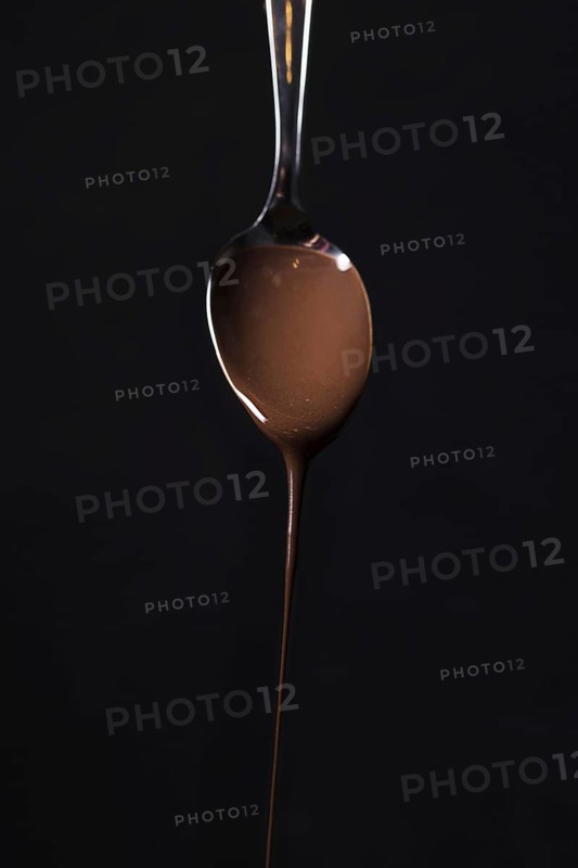 Close up spoon with tasty chocolate mousse