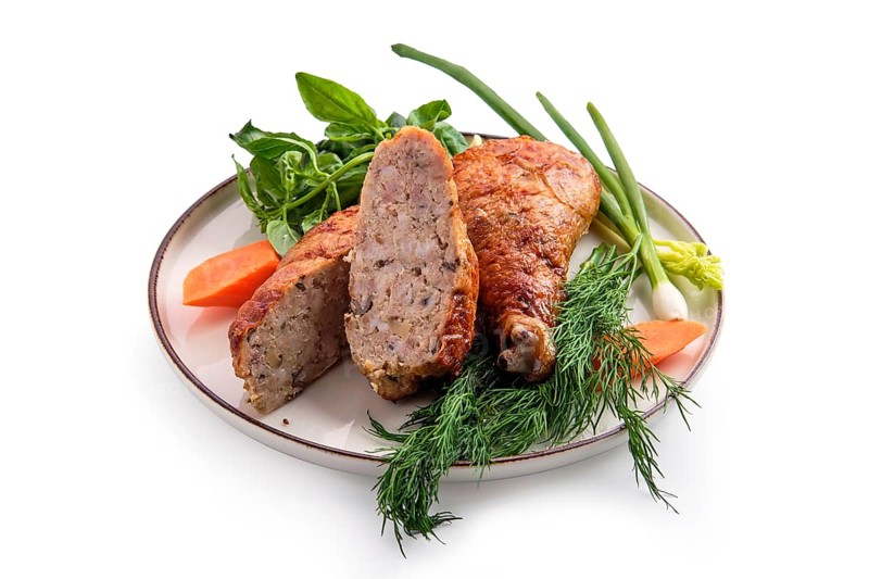 Stuffed chicken thigh decorated with spring onion