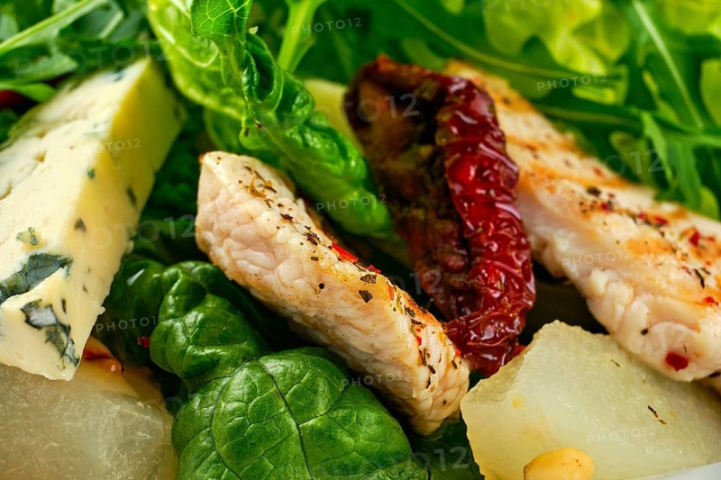 Macro photo of salad with roasted turkey