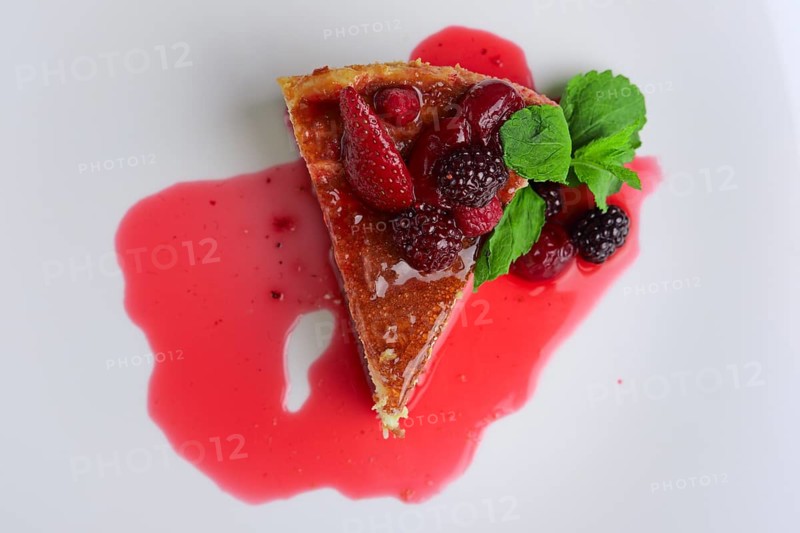 Top view of cheesecake with cherry