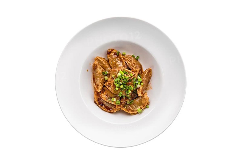 Deep-fried japanese gyoza or dumplings snack with soy sauce isolated on white background