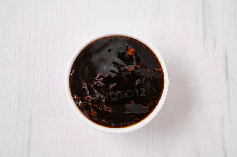 Overhead view of small bowl with spicy teriyaki sauce