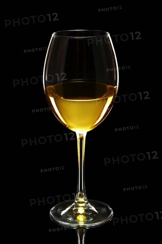 Glass of white wine isolated on black