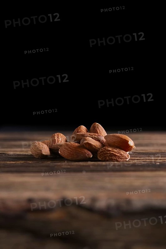 Almonds on the wooden background