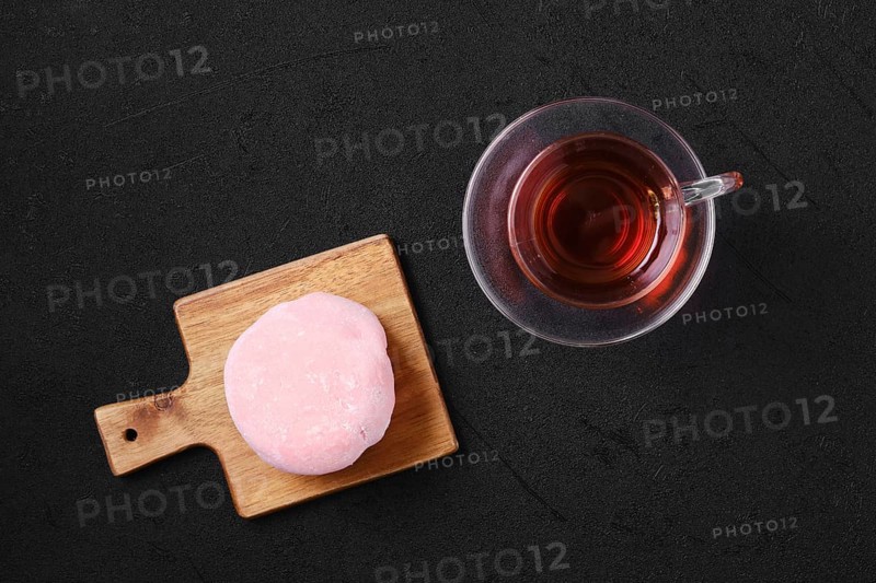 Top view of sweet dessert mochi with strawberry with fruit tea