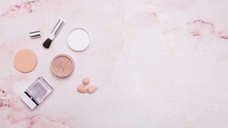 Face powder makeup brush powder puff bottle blender pink backdrop