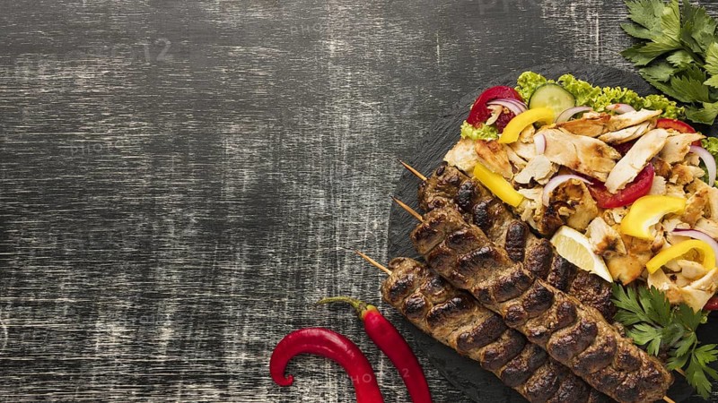 Flat lay tasty kebab with copy space salad